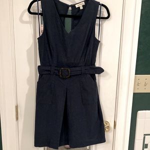 Women’s navy blue sleeveless dress size L with slightly open back and pockets.